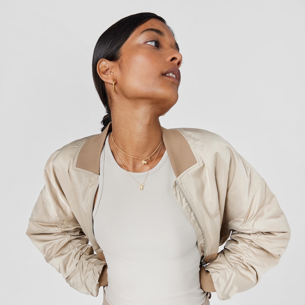 Collar Save le&oacute;n con ba&ntilde;o de oro 18 kt sobre plata y Cord&oacute;n beige