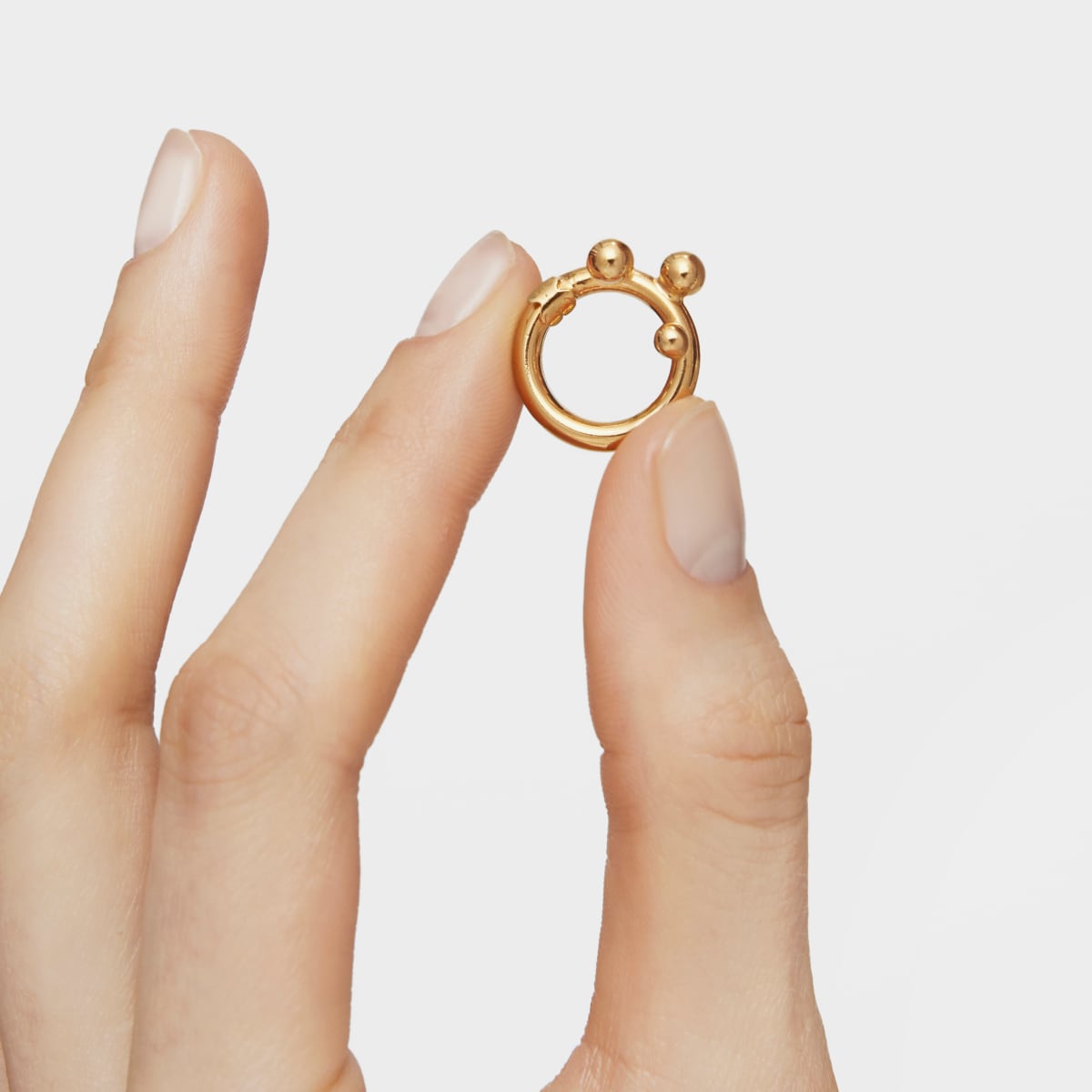 Small Ring with 18kt gold plating over silver and details Hold