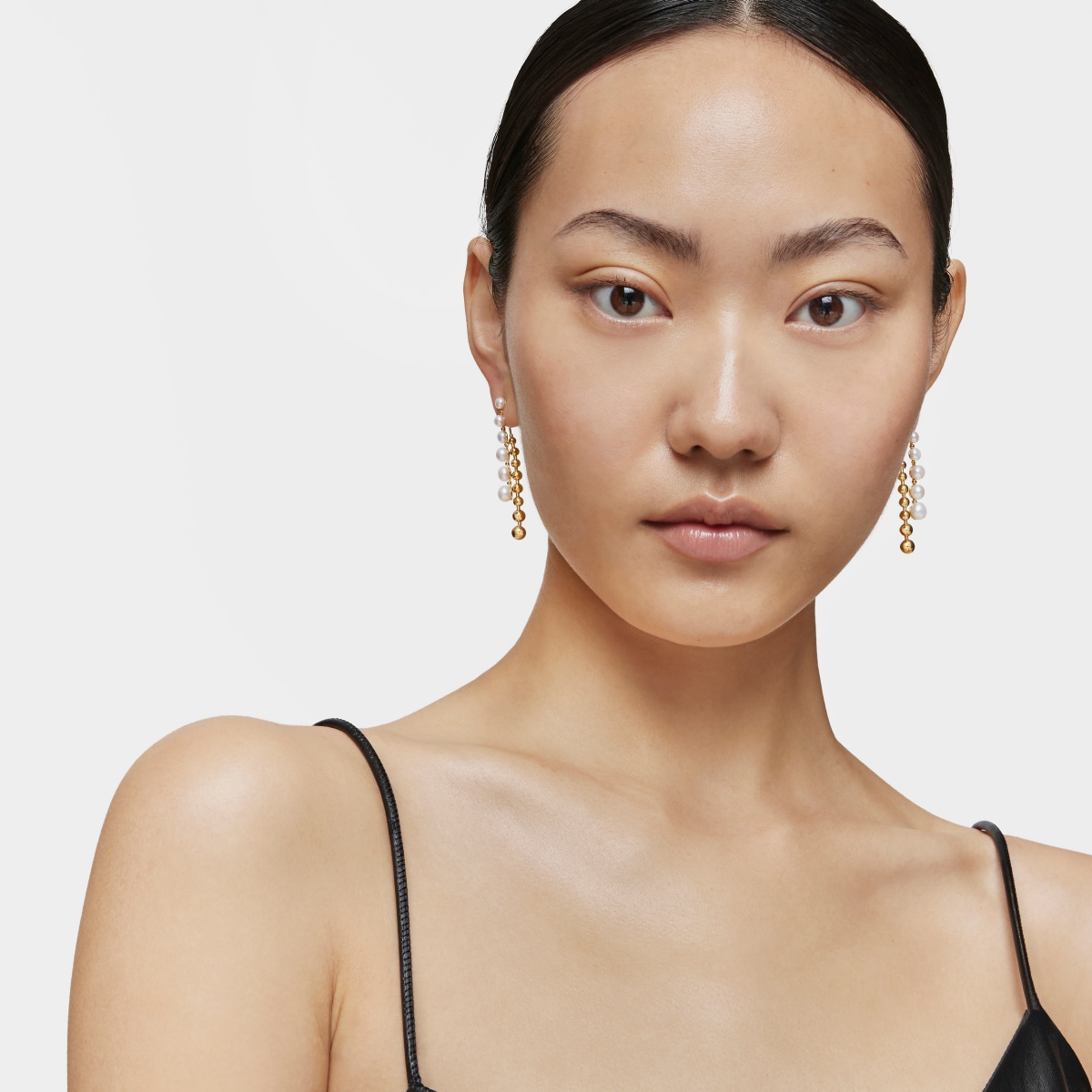 Long double Earrings with 18kt gold plating over silver and cultured pearls Gloss