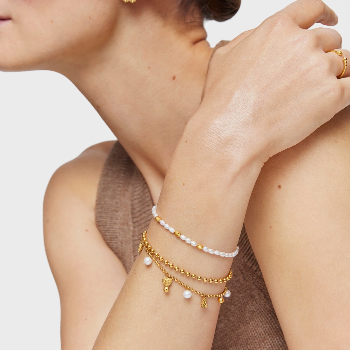 Chain Bracelet with 18kt gold plating over silver and cultured pearls and motifs TOUS Grain