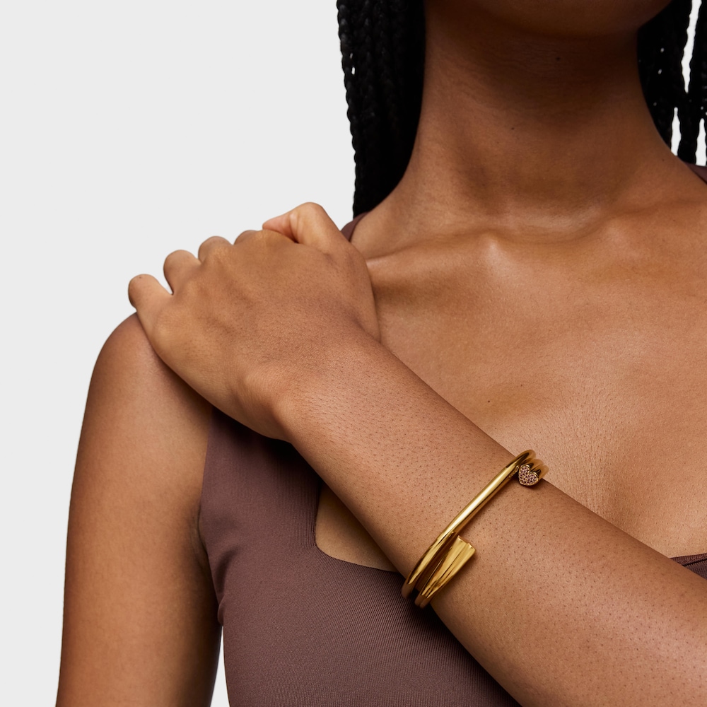 18kt gold plating over silver Bangle with heart motif with rhodolites TOUS 1950 18kt gold plating over silver Bangle with heart motif with rhodolites TOUS 1950