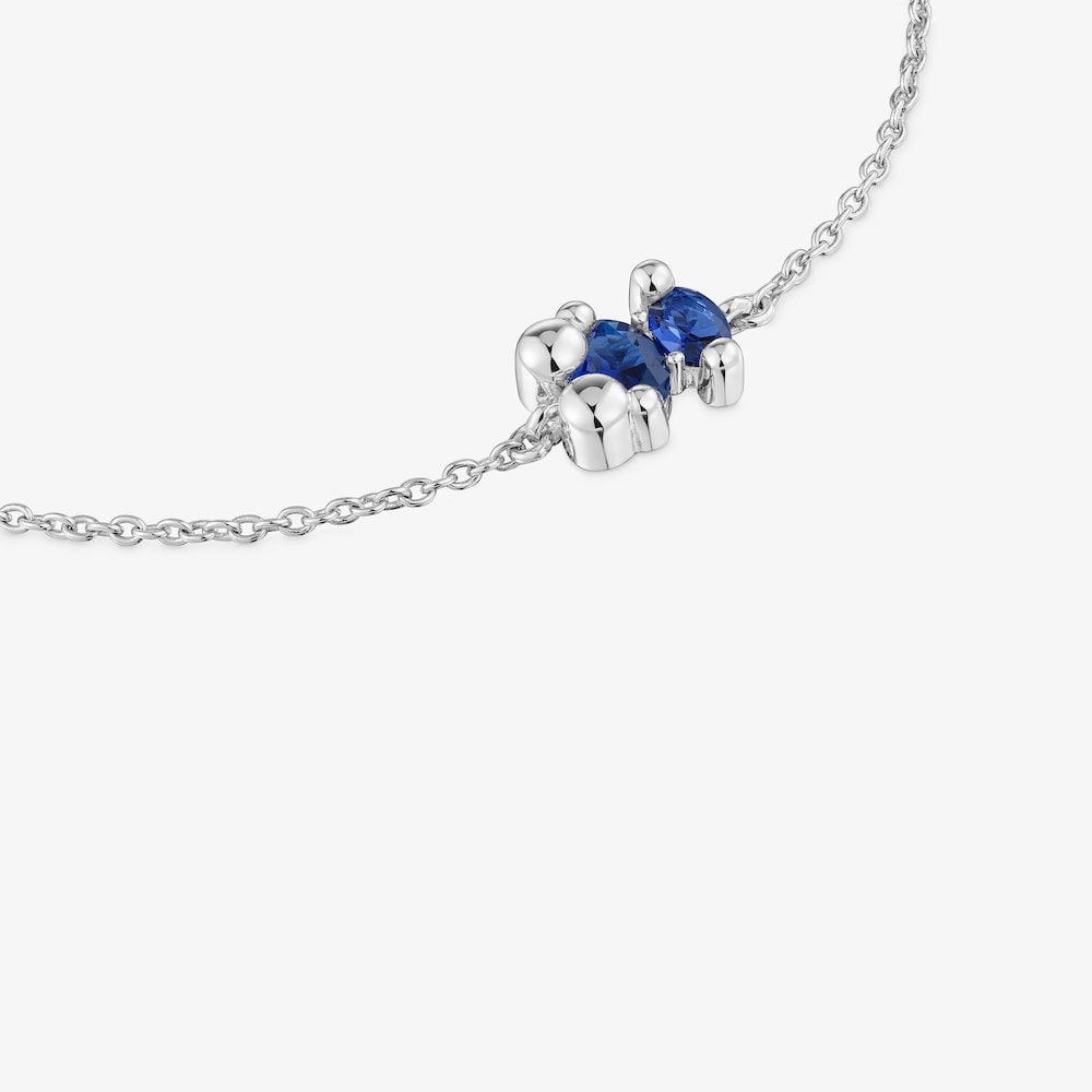 Bracelet cha&icirc;ne motif ourson en argent et saphir bleu cr&eacute;&eacute; en laboratoire Color Bear LGG