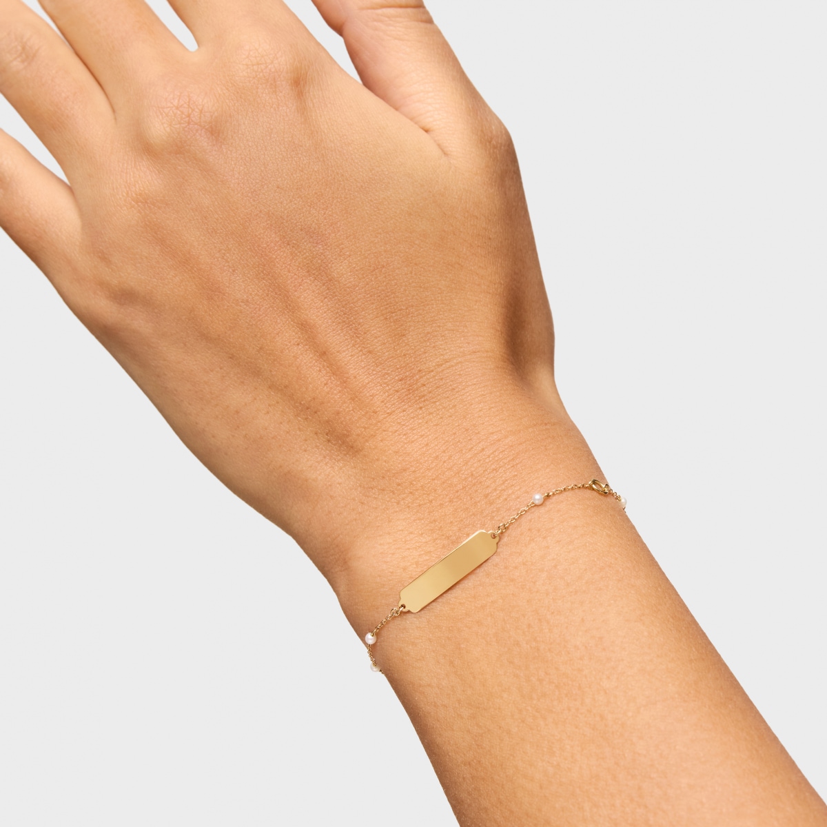 Pulsera placa de oro y perlas cultivadas TOUS Baby