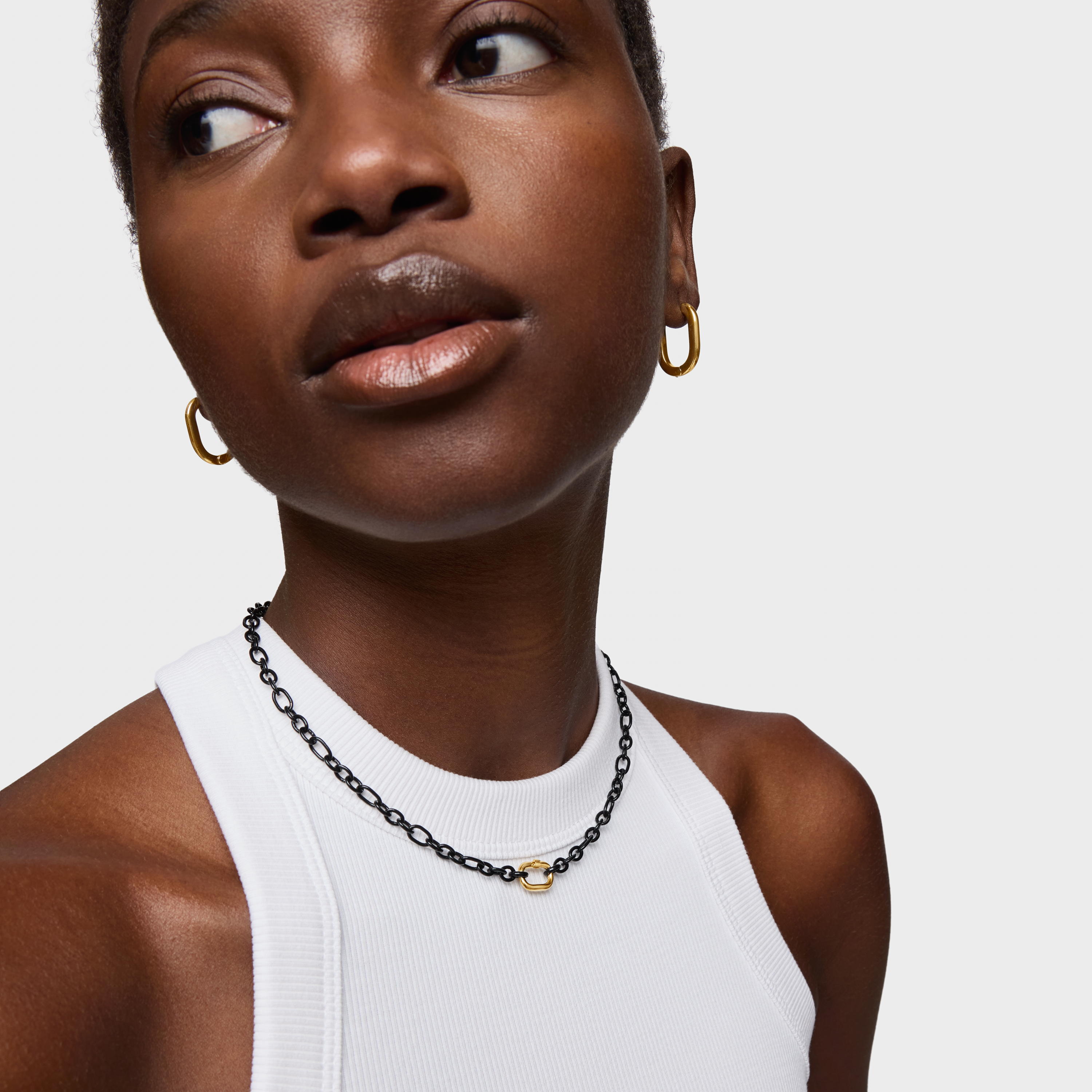 Short dark silver Necklace with 18kt gold plating over silver ring Hold Oval