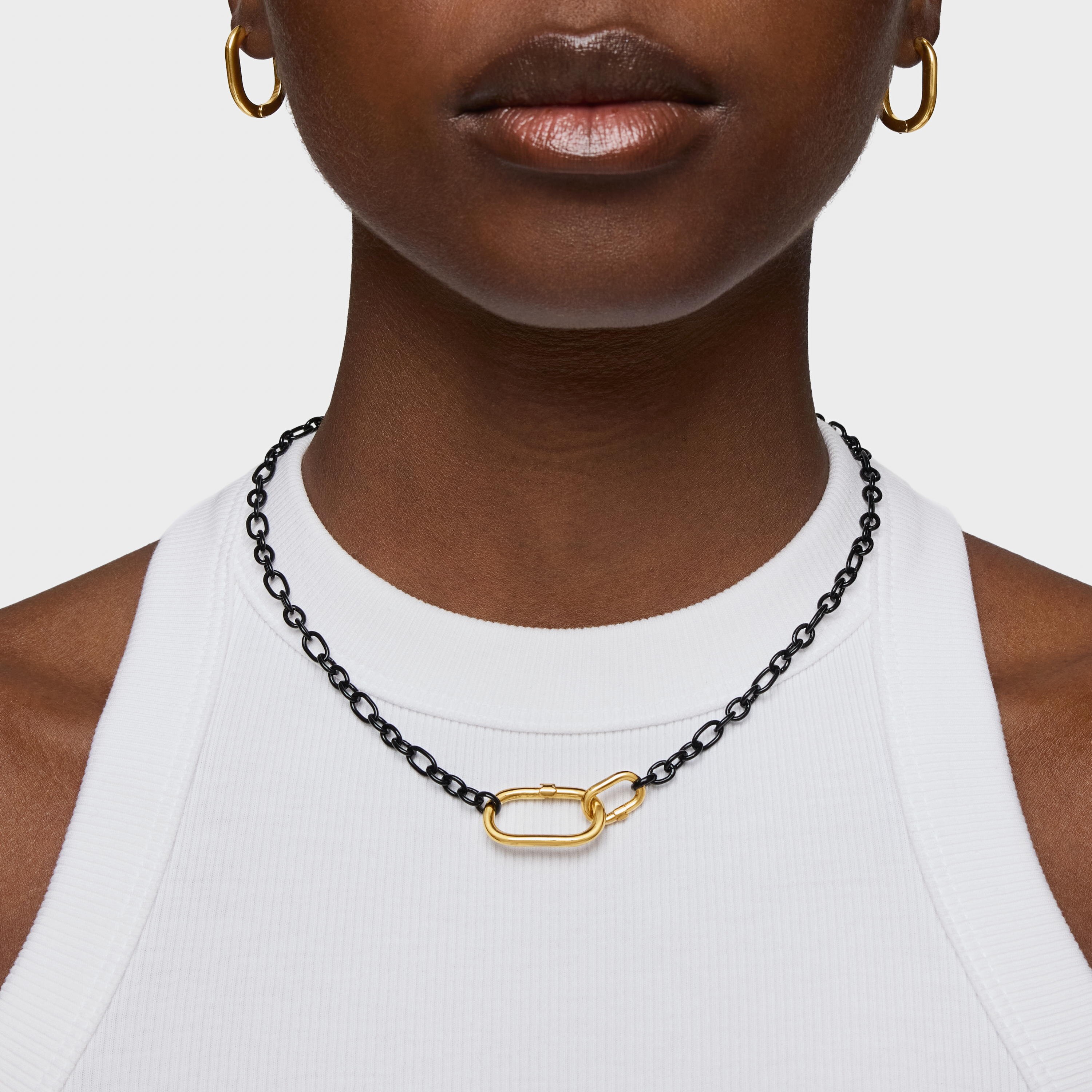 Short dark silver Necklace with 18kt gold plating over silver ring Hold Oval