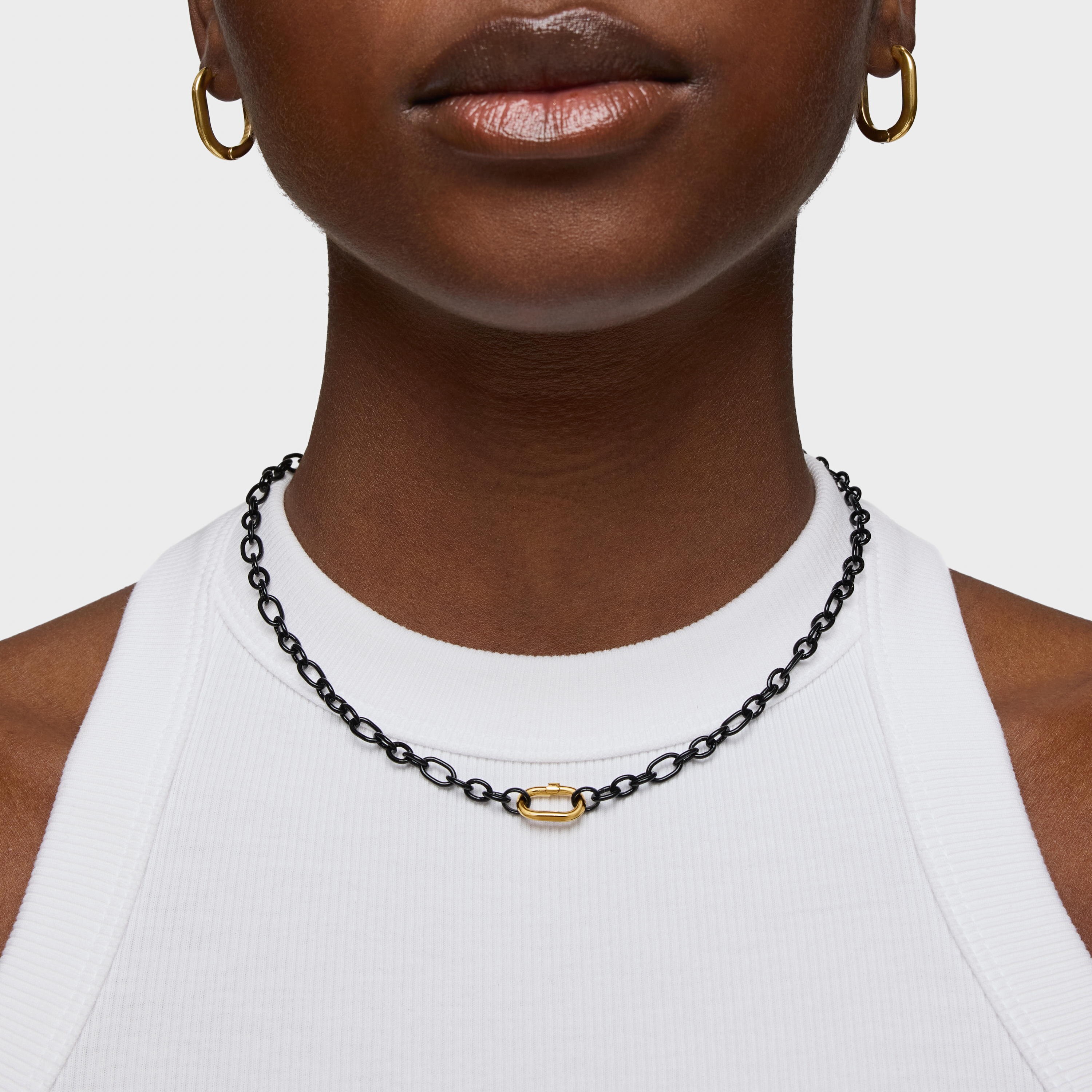 Short dark silver Necklace with 18kt gold plating over silver ring Hold Oval