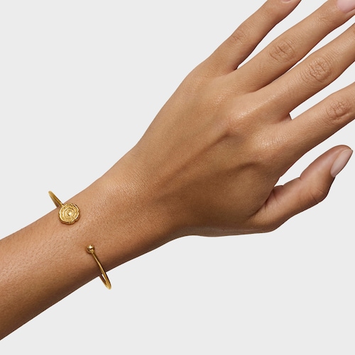 Pulsera esclava con baño de oro 18 kt sobre plata y detalle flor Cachito Mío