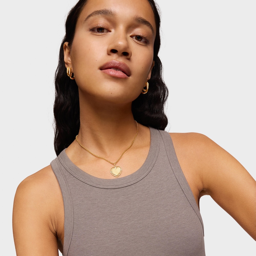 Wisiorek ze srebra pokrytego 18-karatowym złotem z motywem serca i topazami Medallions