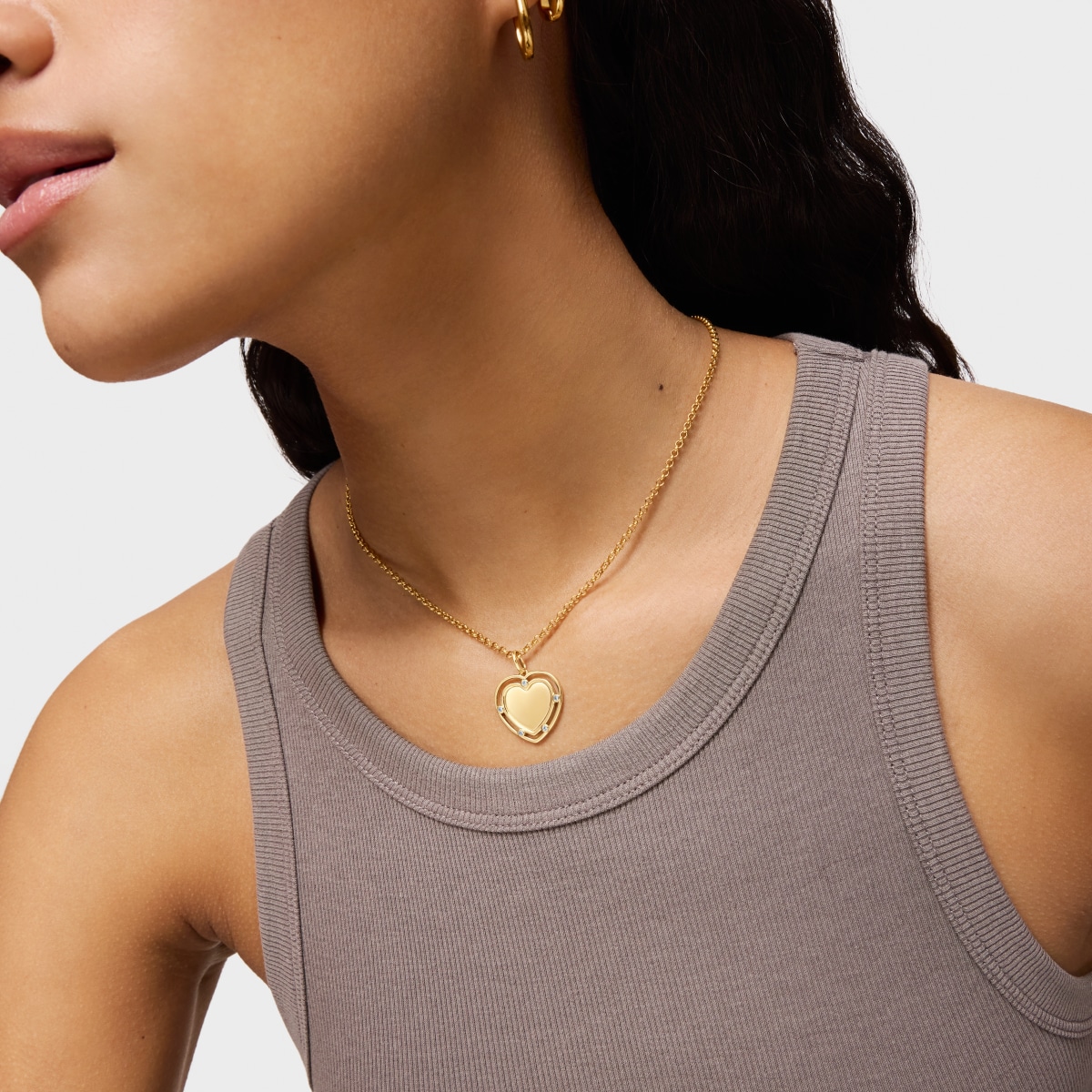 Colgante corazón con baño de oro 18 kt sobre plata y topacios Medallions
