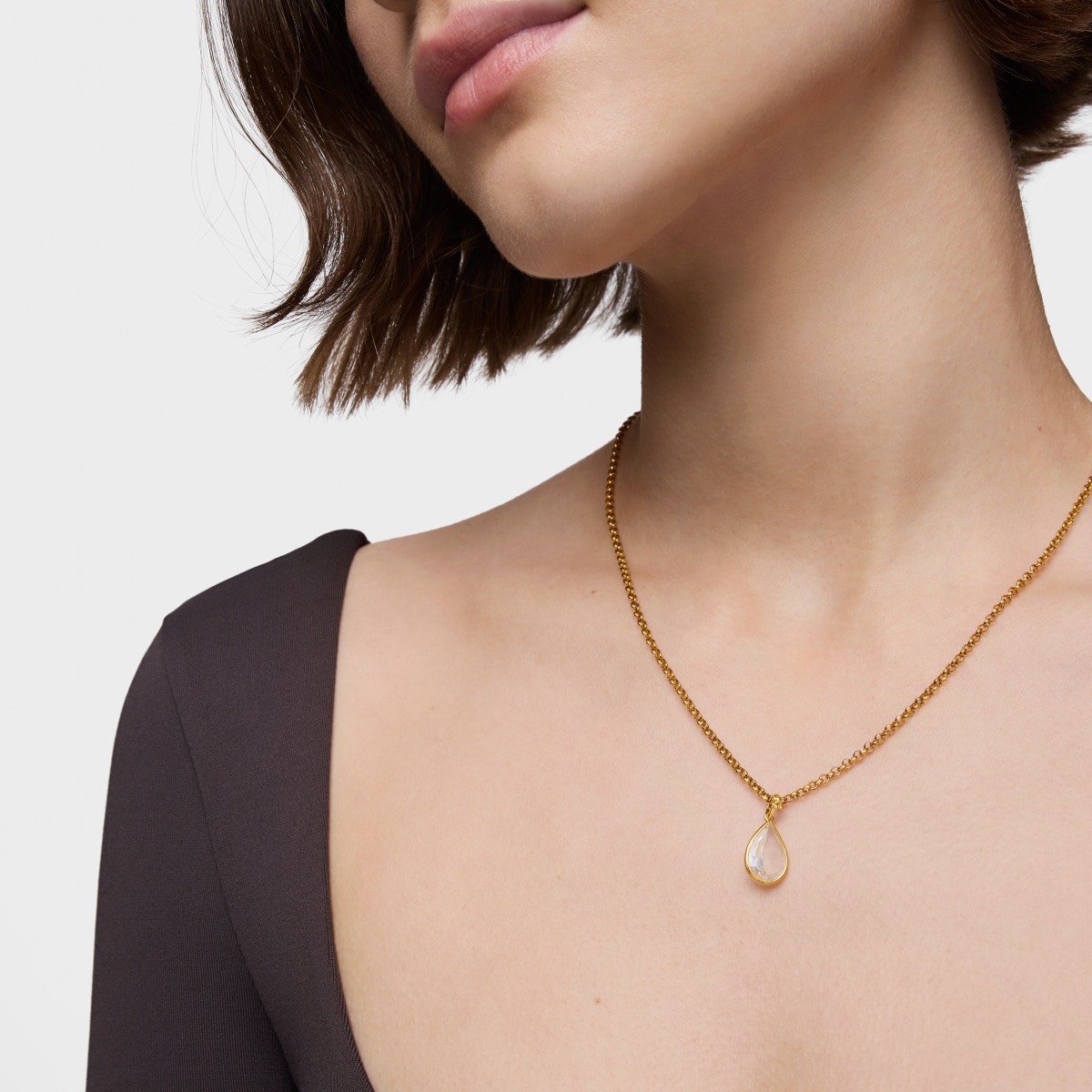 Colgante pequeño con baño de oro 18 kt sobre plata y cristal de roca Medallions