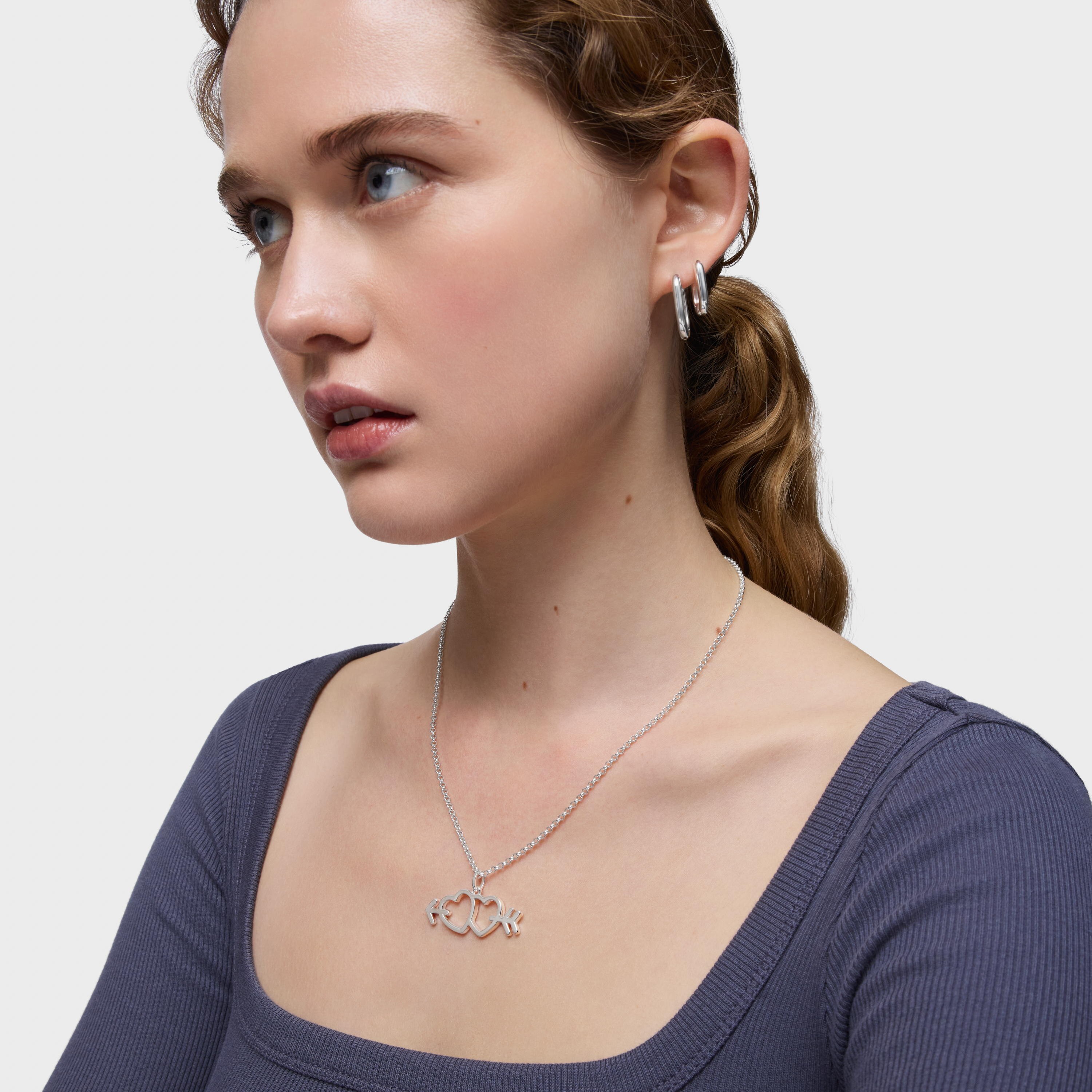 Silver pendant with arrow/heart motifs Medallions