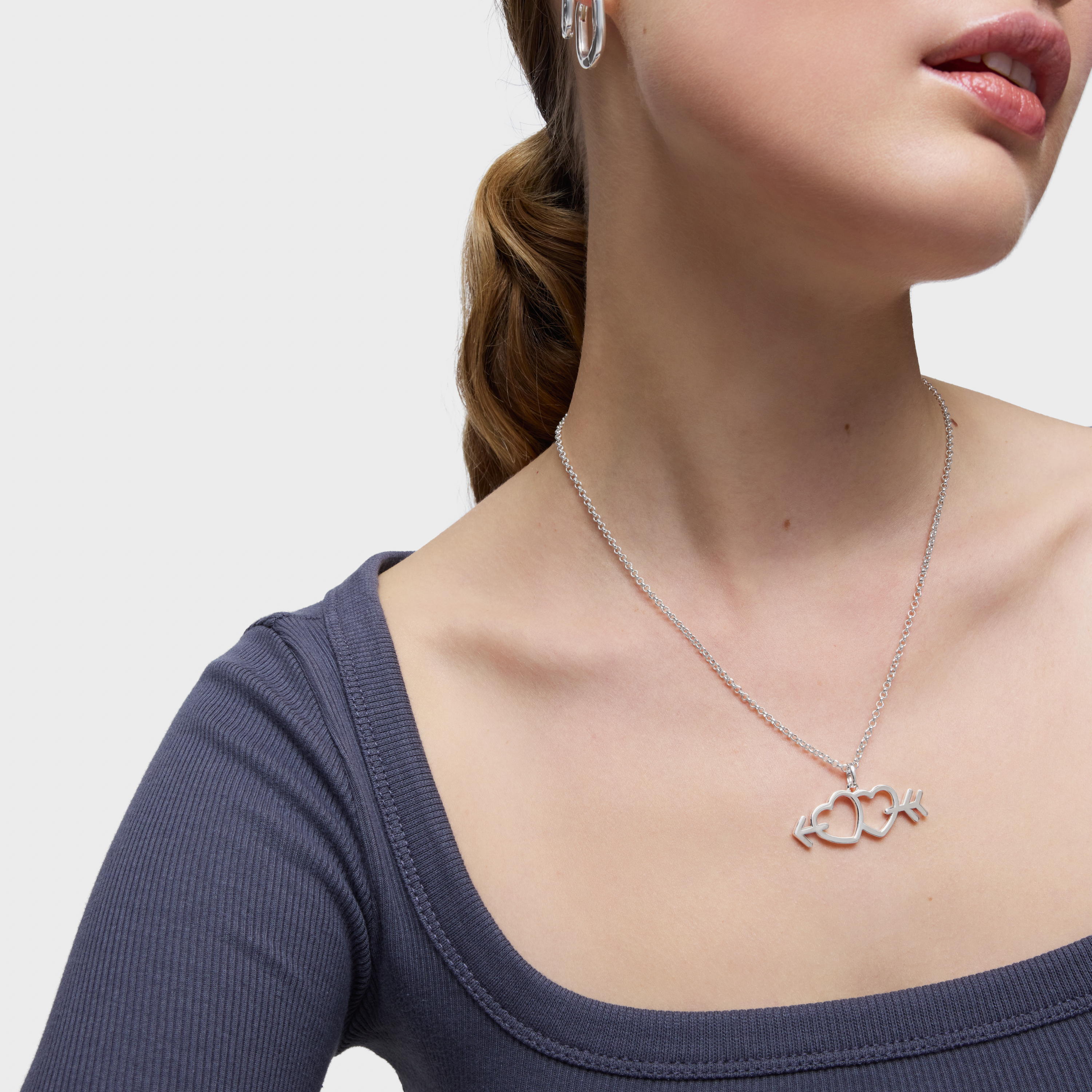 Silver pendant with arrow/heart motifs Medallions