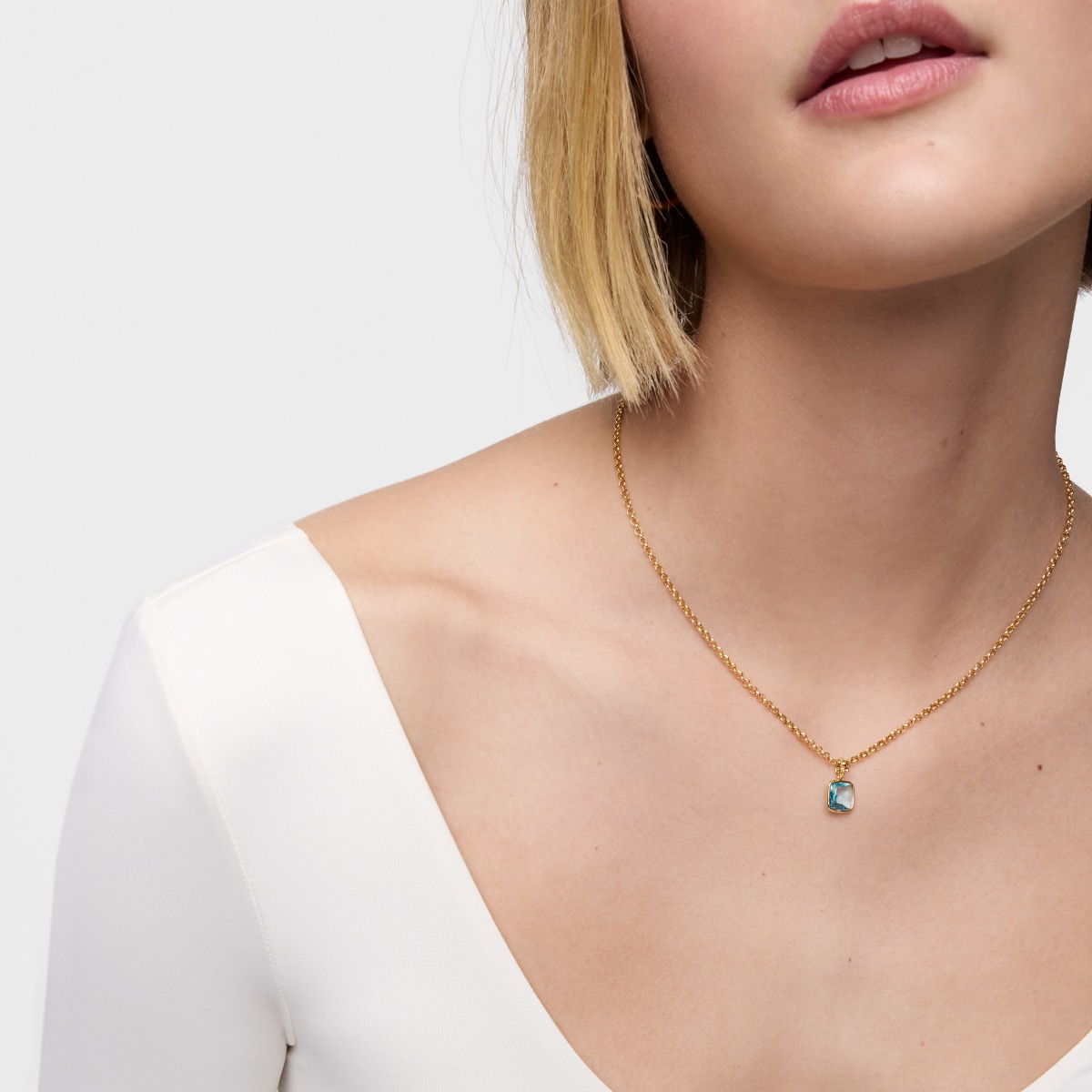 Colgante pequeño con baño de oro 18 kt sobre plata y topacio Medallions