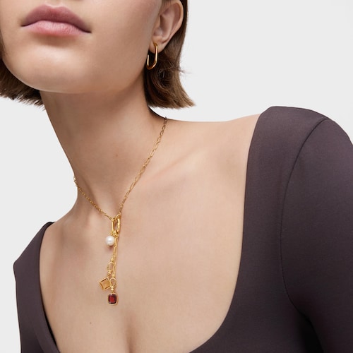 Colgante pequeño con baño de oro 18 kt sobre plata y granate Medallions