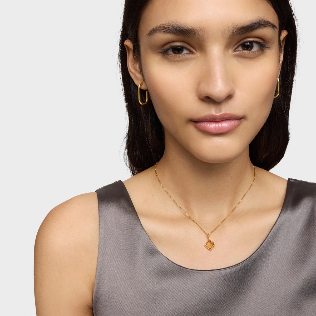 Colgante pequeño con baño de oro 18 kt sobre plata y citrino Medallions
