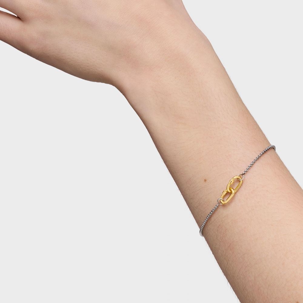 Pulsera cadena de acero y anilla de oro Hold Oval