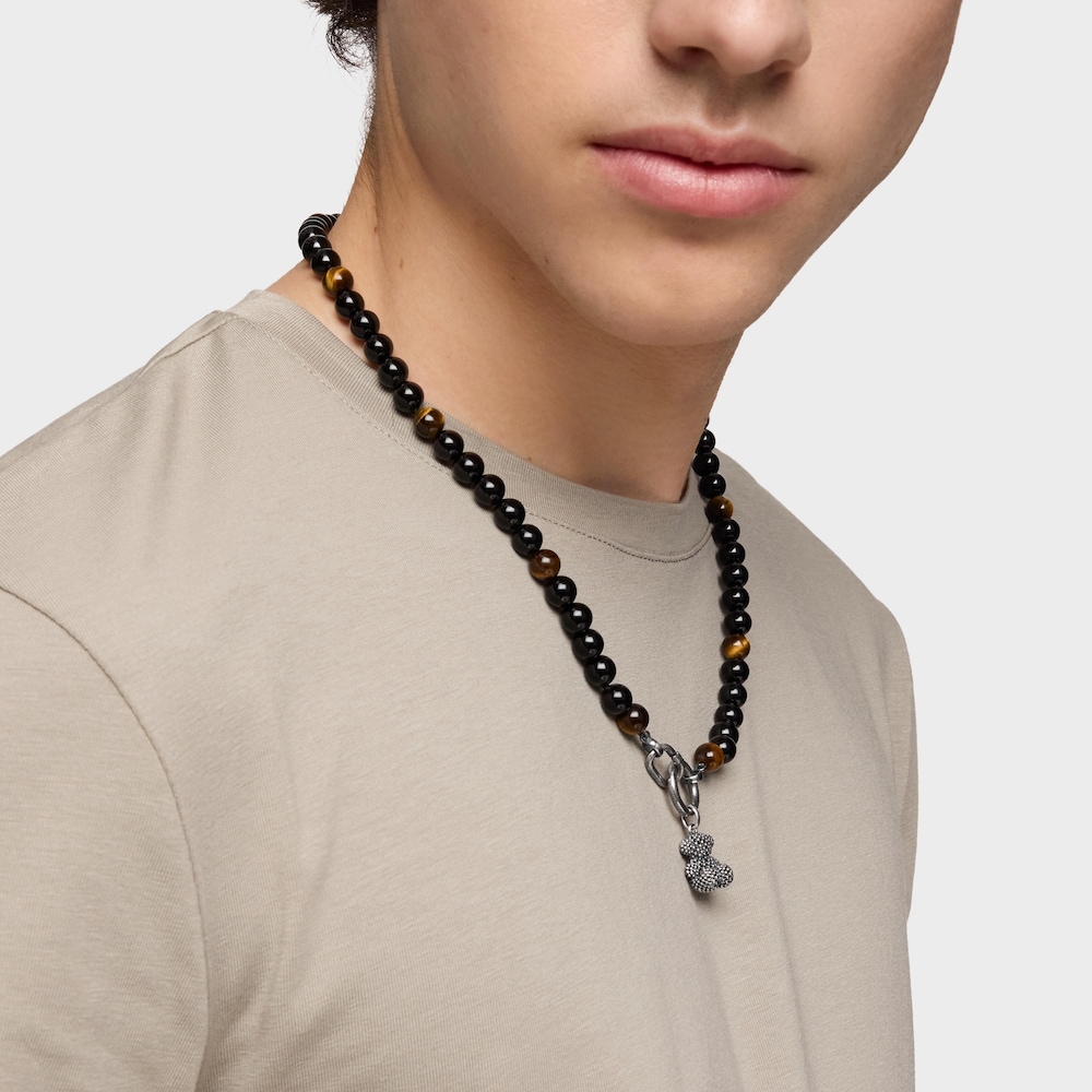 Silver necklace with onyx, tiger’s eye, and Hold Man rings
