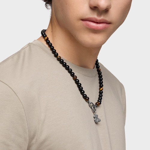 Silver necklace with onyx, tiger’s eye, and Hold Man rings