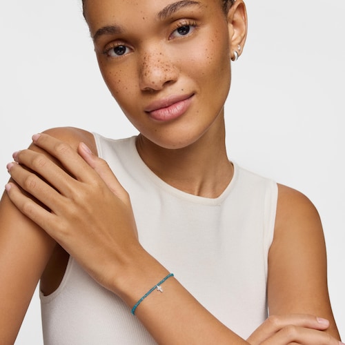 Pulsera elástica con apatito neón y cruz de plata TOUS Motivos