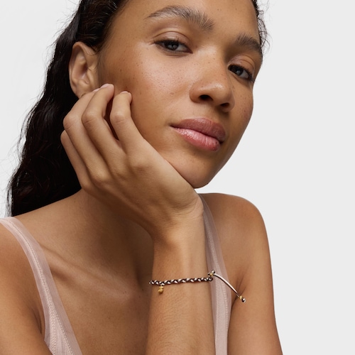 Pulsera oso con baño de oro 18 kt sobre plata y nylon marrón TOUS Motivos