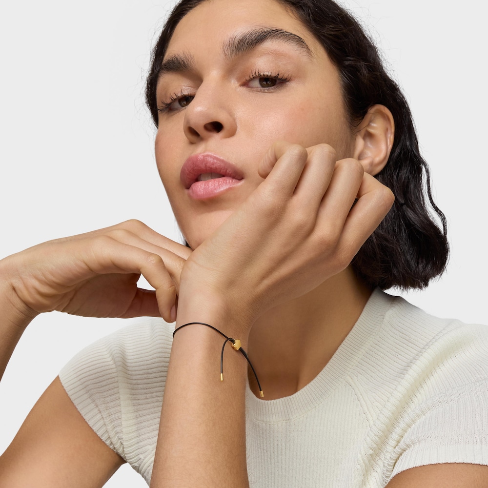 Pulsera flor de oro 14 kt y caucho Bold Motif