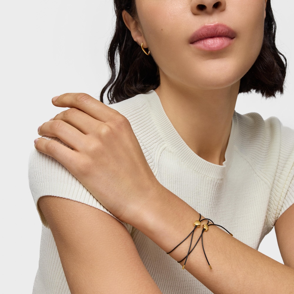 Pulsera flor de oro 14 kt y caucho Bold Motif