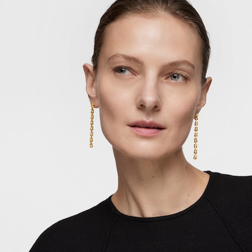 Aretes largos de acero en color dorado con motivos oso Carrusel