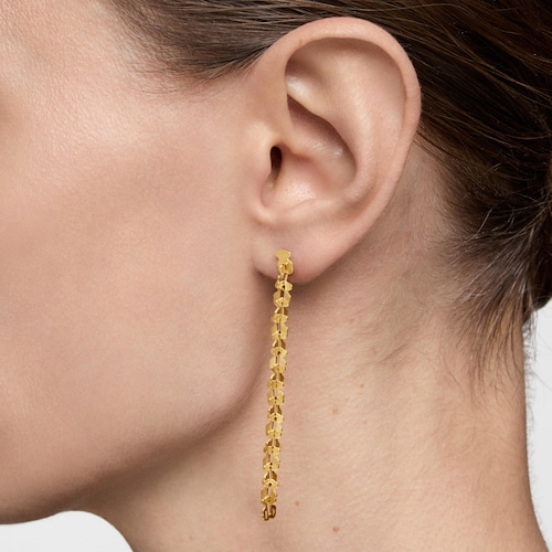 Aretes largos de acero en color dorado con motivos oso Carrusel