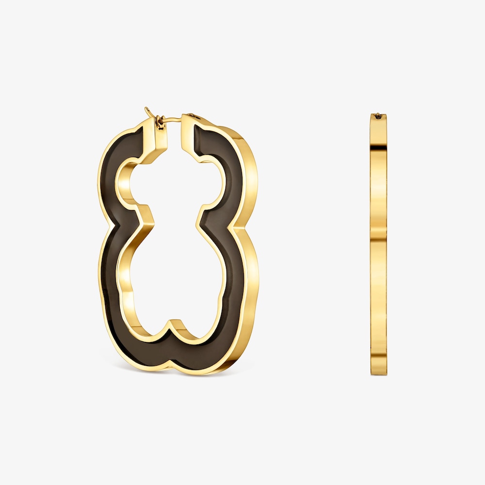 N&aacute;u&scaron;nice ve tvaru medv&iacute;dka o&nbsp;velikosti 53&nbsp;mm z&nbsp;oceli ve zlat&eacute; barvě a&nbsp;čern&eacute; pryskyřice TOUS Galaxy