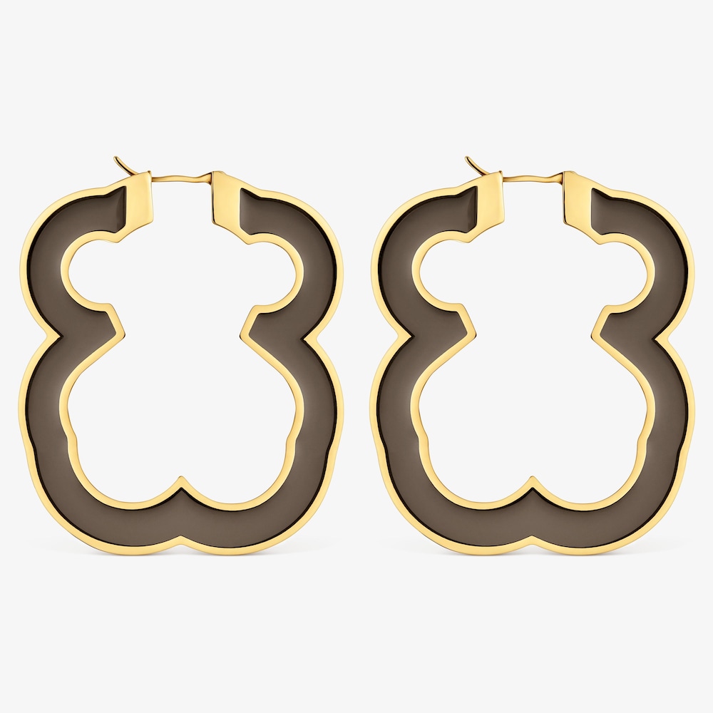 N&aacute;u&scaron;nice ve tvaru medv&iacute;dka o&nbsp;velikosti 53&nbsp;mm z&nbsp;oceli ve zlat&eacute; barvě a&nbsp;čern&eacute; pryskyřice TOUS Galaxy