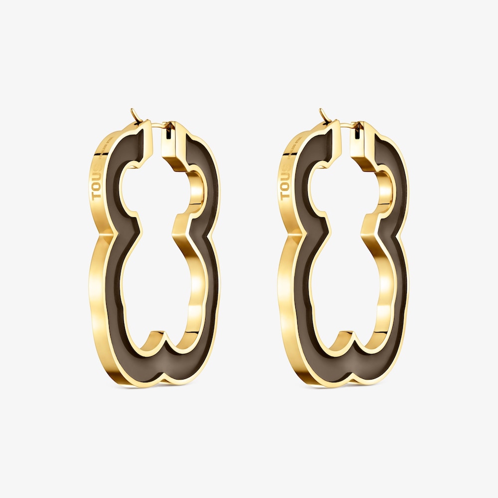 N&aacute;u&scaron;nice ve tvaru medv&iacute;dka o&nbsp;velikosti 53&nbsp;mm z&nbsp;oceli ve zlat&eacute; barvě a&nbsp;čern&eacute; pryskyřice TOUS Galaxy