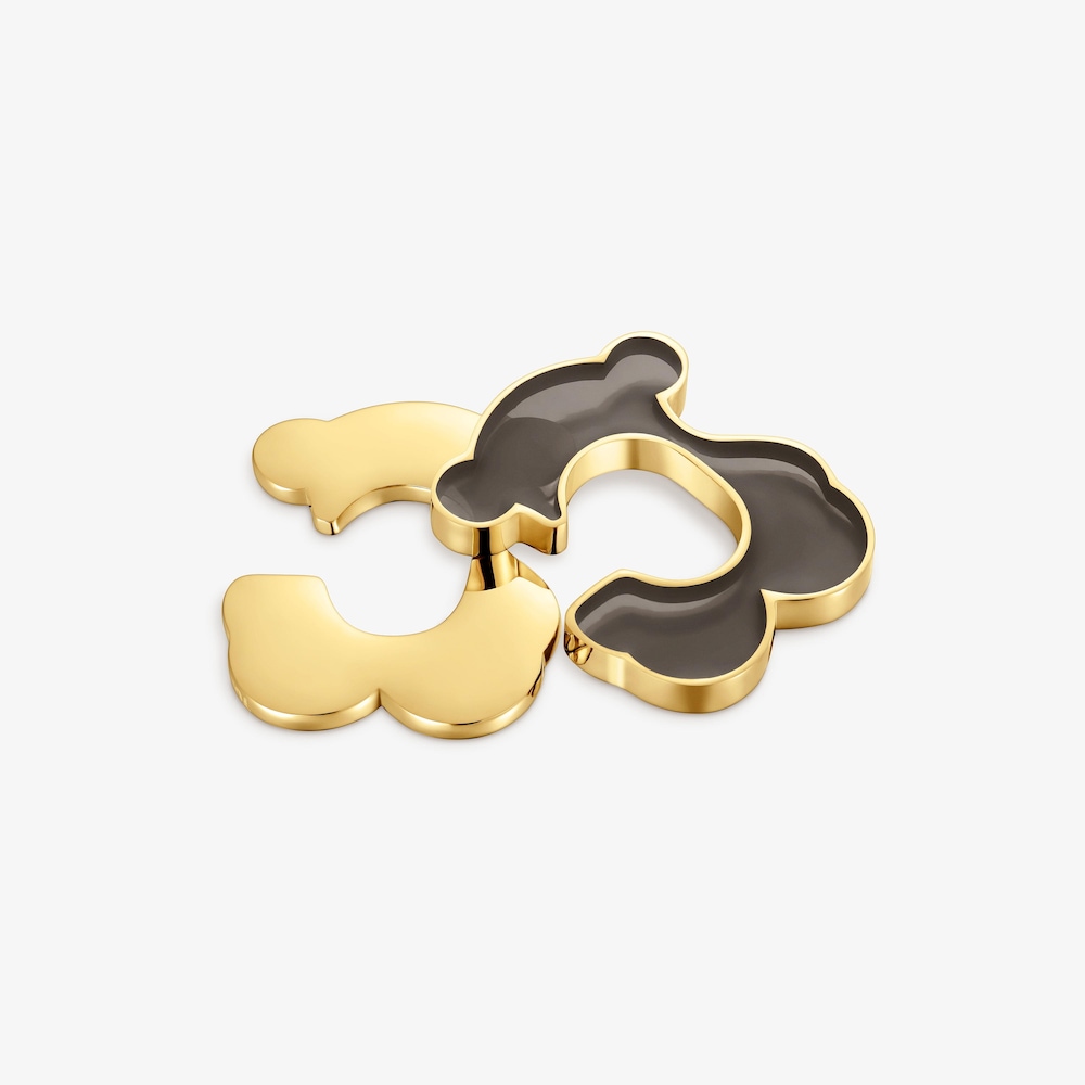 Z&aacute;u&scaron;nica s&nbsp;medved&iacute;kom z&nbsp;ocele zlatej farby a&nbsp;čiernej živice TOUS Galaxy