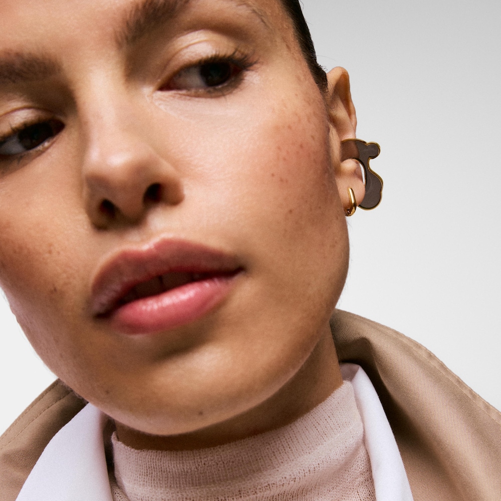 Z&aacute;u&scaron;nica s&nbsp;medved&iacute;kom z&nbsp;ocele zlatej farby a&nbsp;čiernej živice TOUS Galaxy