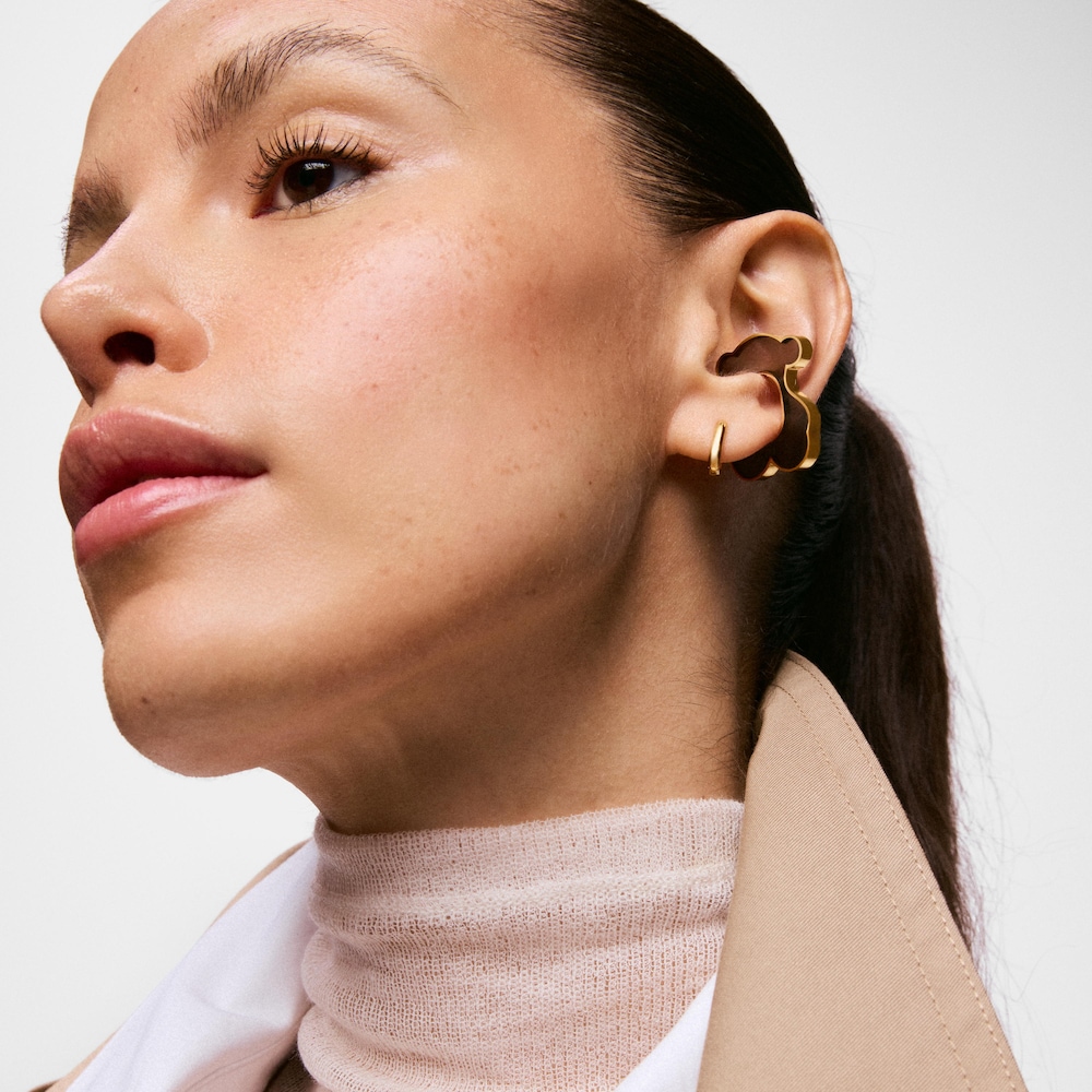 Z&aacute;u&scaron;nica s&nbsp;medved&iacute;kom z&nbsp;ocele zlatej farby a&nbsp;čiernej živice TOUS Galaxy