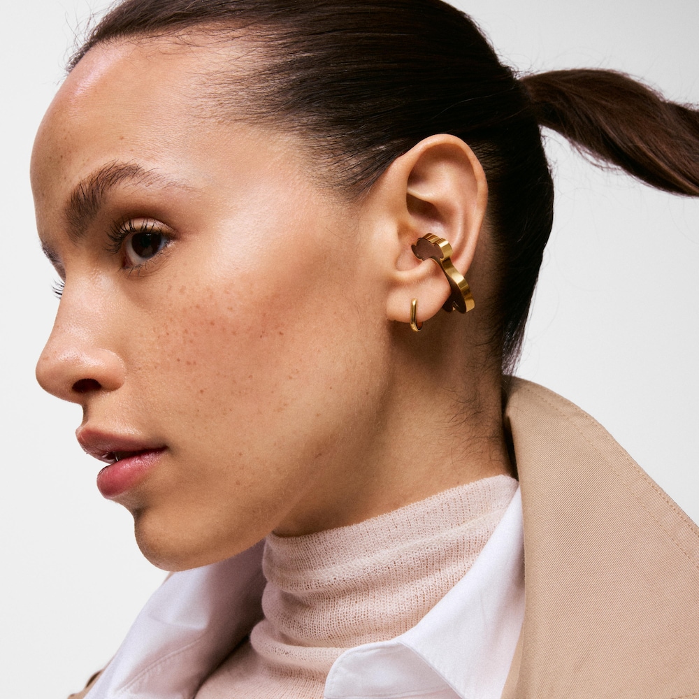 Z&aacute;u&scaron;nica s&nbsp;medved&iacute;kom z&nbsp;ocele zlatej farby a&nbsp;čiernej živice TOUS Galaxy