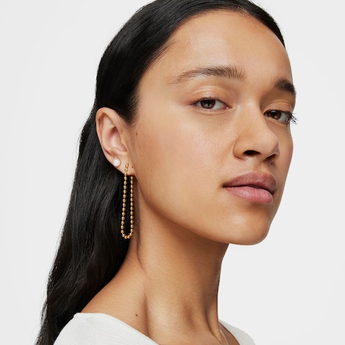 Pendientes asimétricos con baño de oro 18 kt sobre plata y perla Gloss