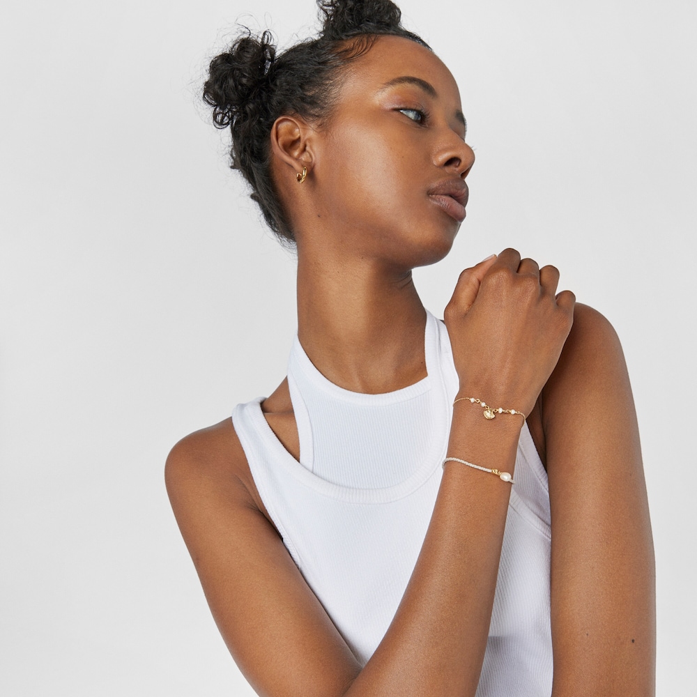 Pulsera con ba&ntilde;o de oro 18 kt sobre plata, perla y hilo trenzado gris Sea Vibes