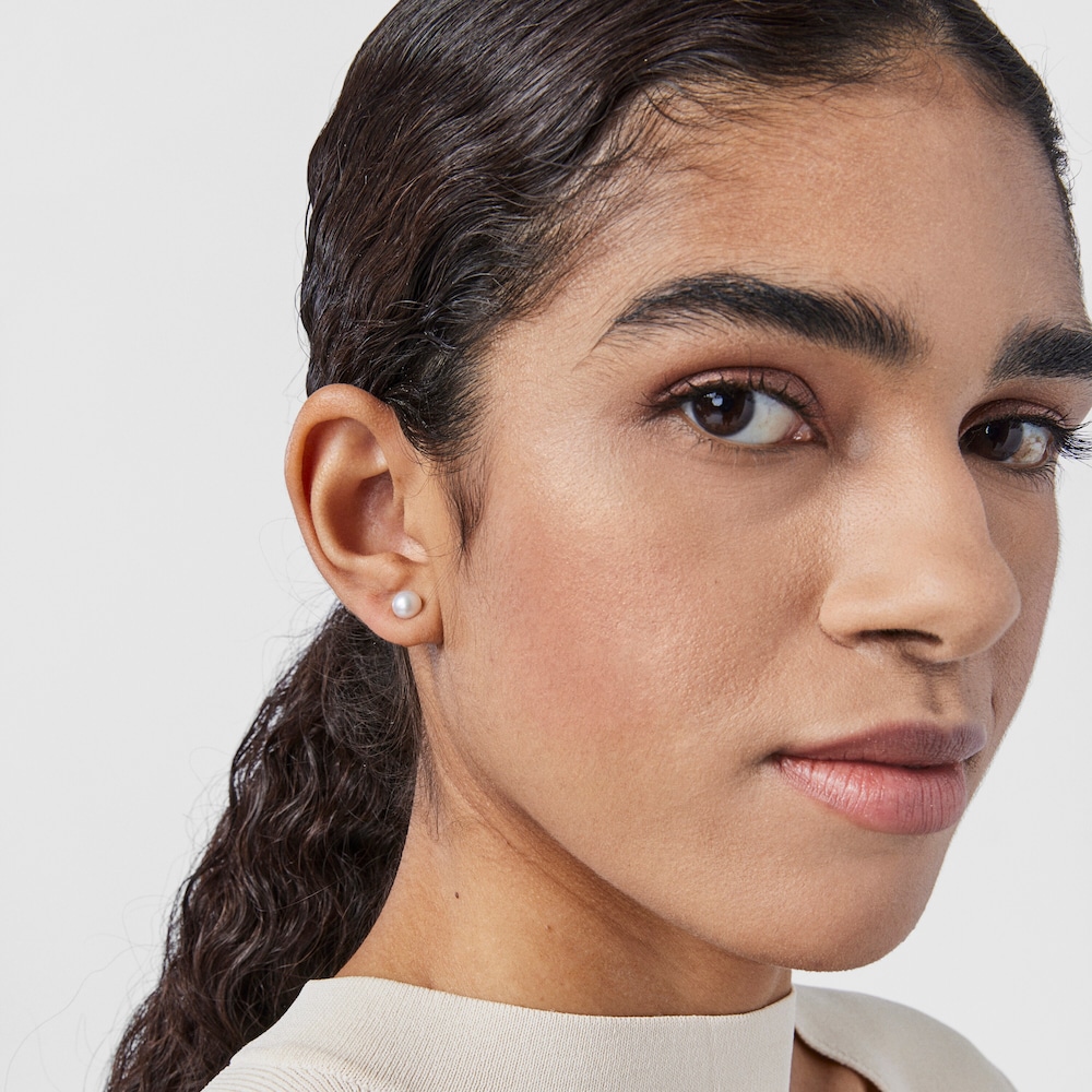 Aretes Fragile Nature flor con ba&ntilde;o de oro 18 kt sobre plata y perla