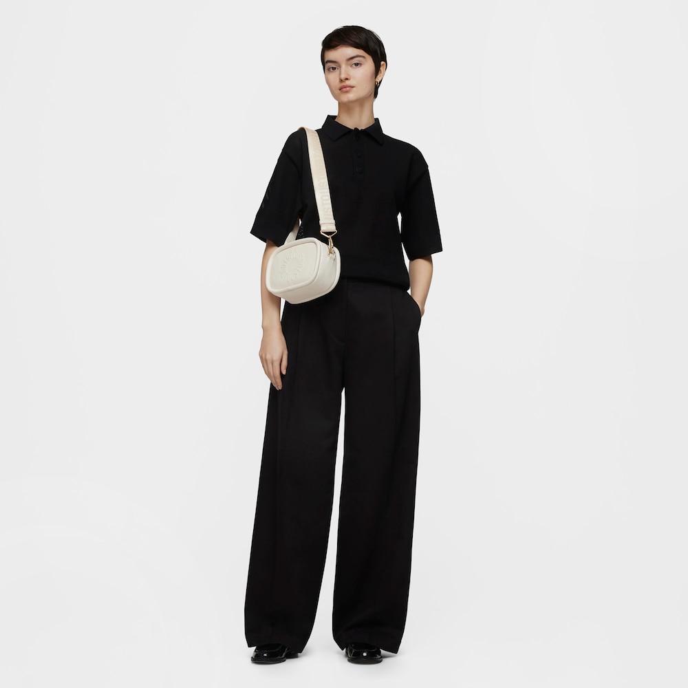 Beżowa sk&oacute;rzana torebka przez ramię typu reporter TOUS Miranda