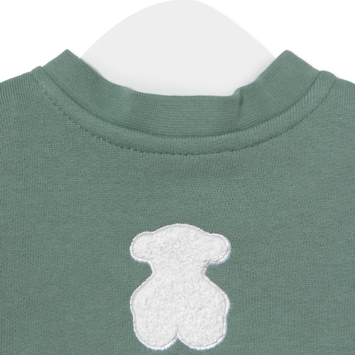 Baby bodysuit with smock in Soft green
