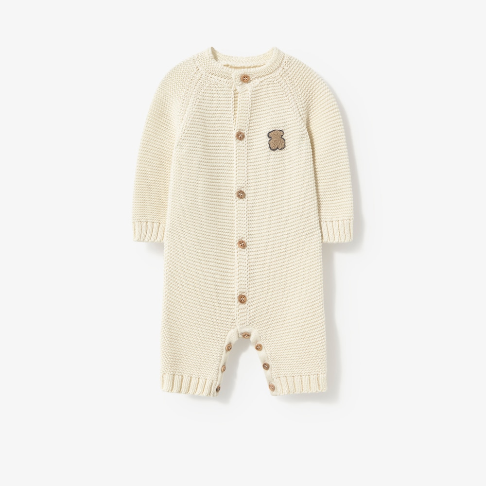 Newborn baby romper in natural-coloured knit