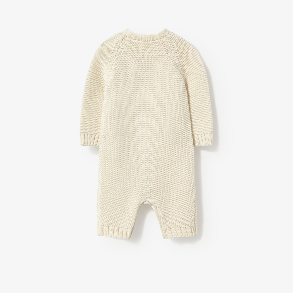 Newborn baby romper in natural-coloured knit