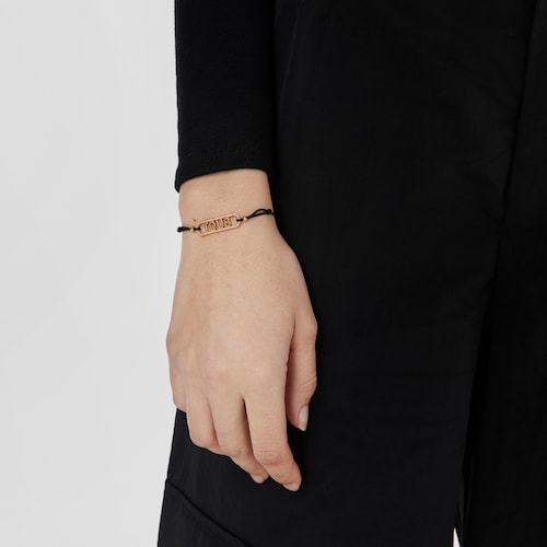 Pulsera de nylon negro, plata con baño de oro 18 kt sobre plata y diamantes Logo