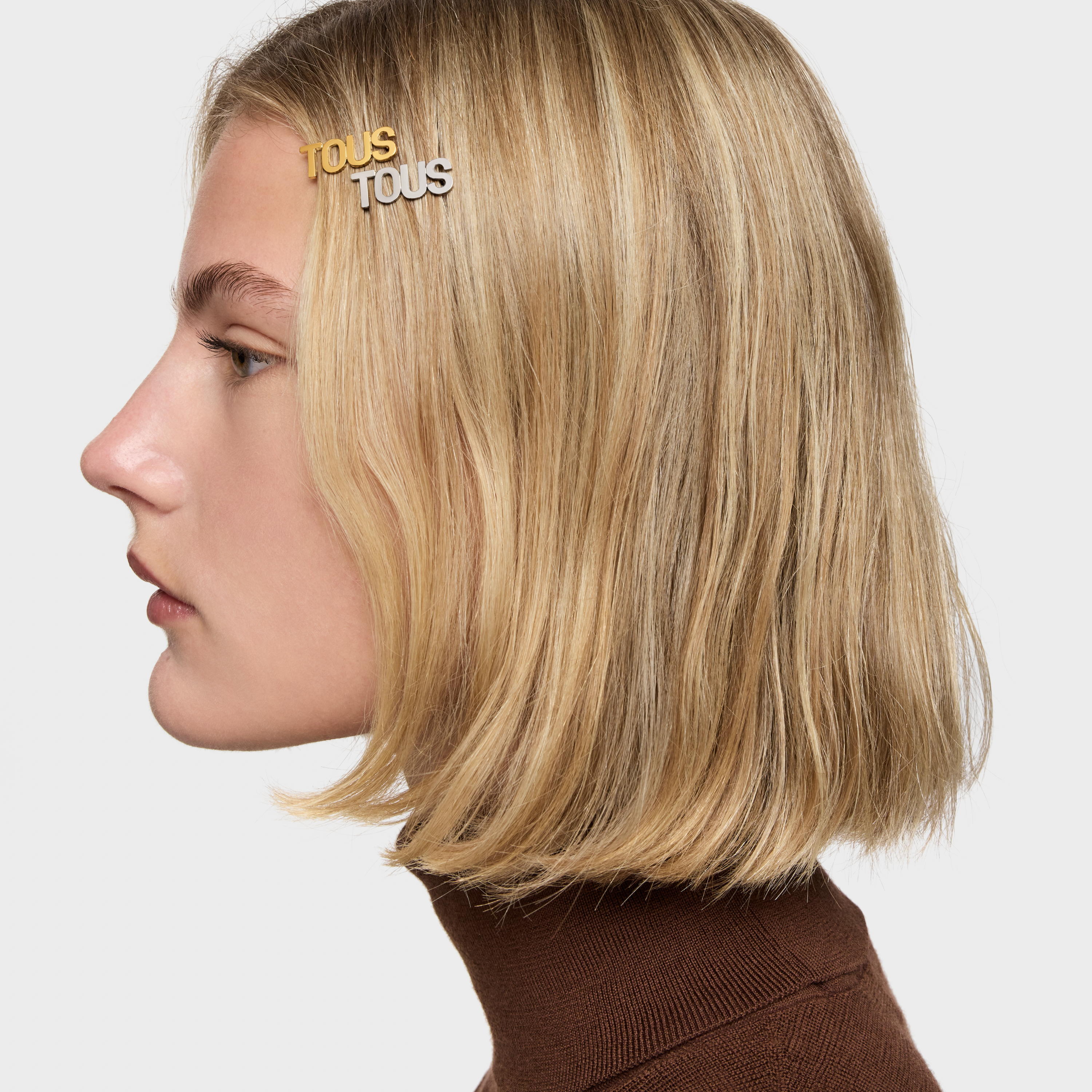 Gold colored IPG steel Clip Logo