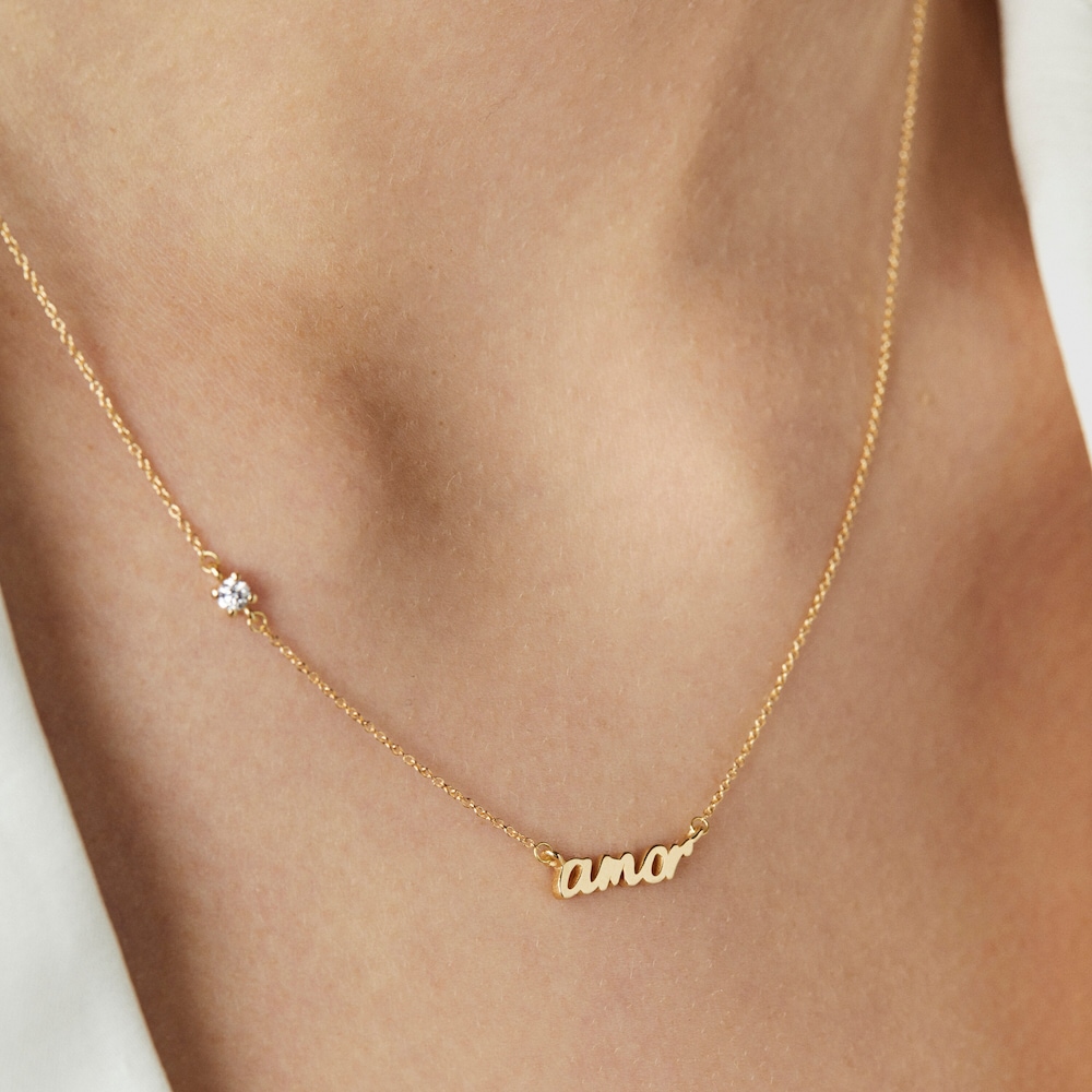 Collar amor de oro y diamante Crossword