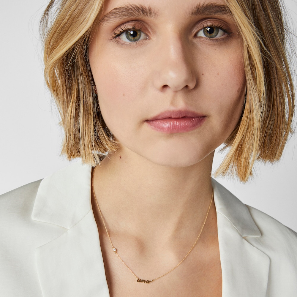 Collar amor de oro y diamante Crossword