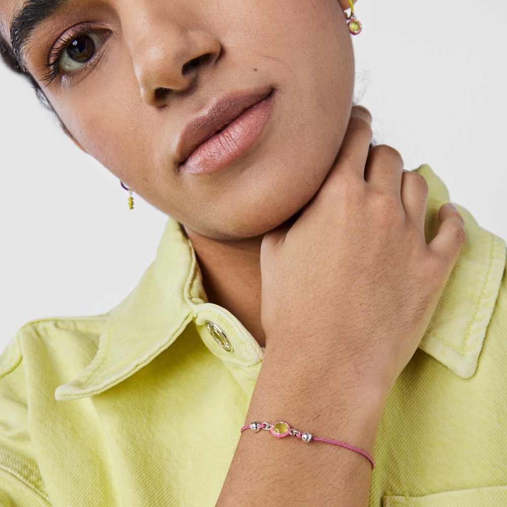 Bra&ccedil;alet TOUS Vibrant Colors de cord&oacute; rosa amb calced&ograve;nia i esmalt