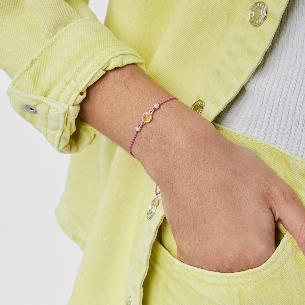 Bra&ccedil;alet TOUS Vibrant Colors de cord&oacute; rosa amb calced&ograve;nia i esmalt