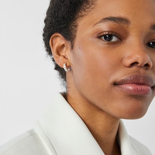 Small silver TOUS Bear Row hoop earrings with silhouette