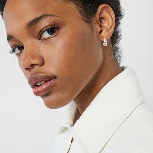 Small silver TOUS Bear Row hoop earrings with silhouette